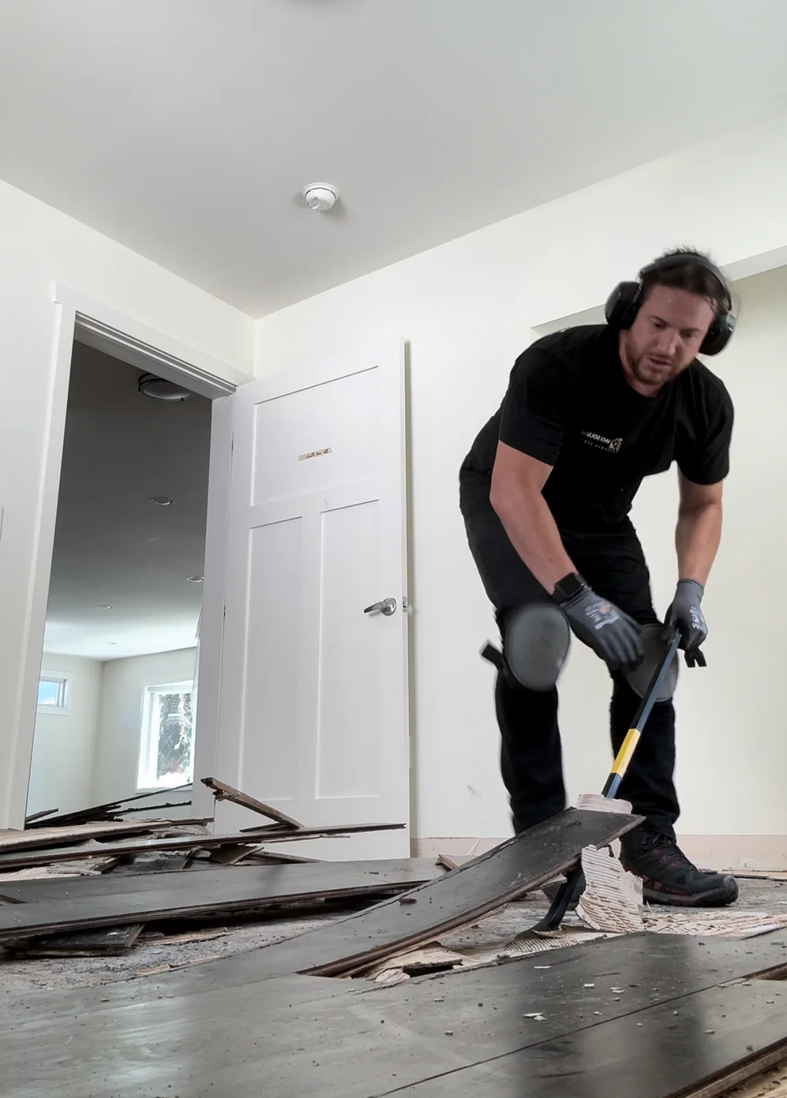 A Wix Solutions installer working on a floor