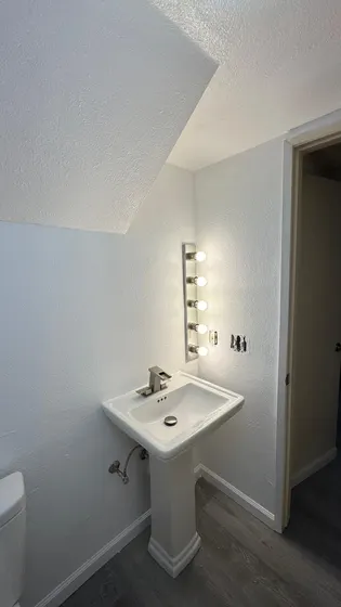 Bathroom vanity and toilet