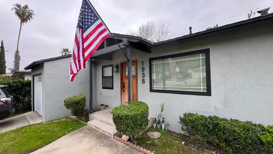 Completed house facade with flag