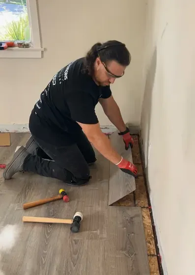 Installer measuring floor
