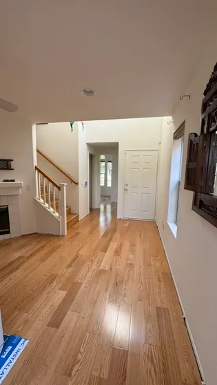 Finished hallway with wood-tone floor
