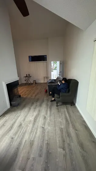 Room with installed gray plank floor